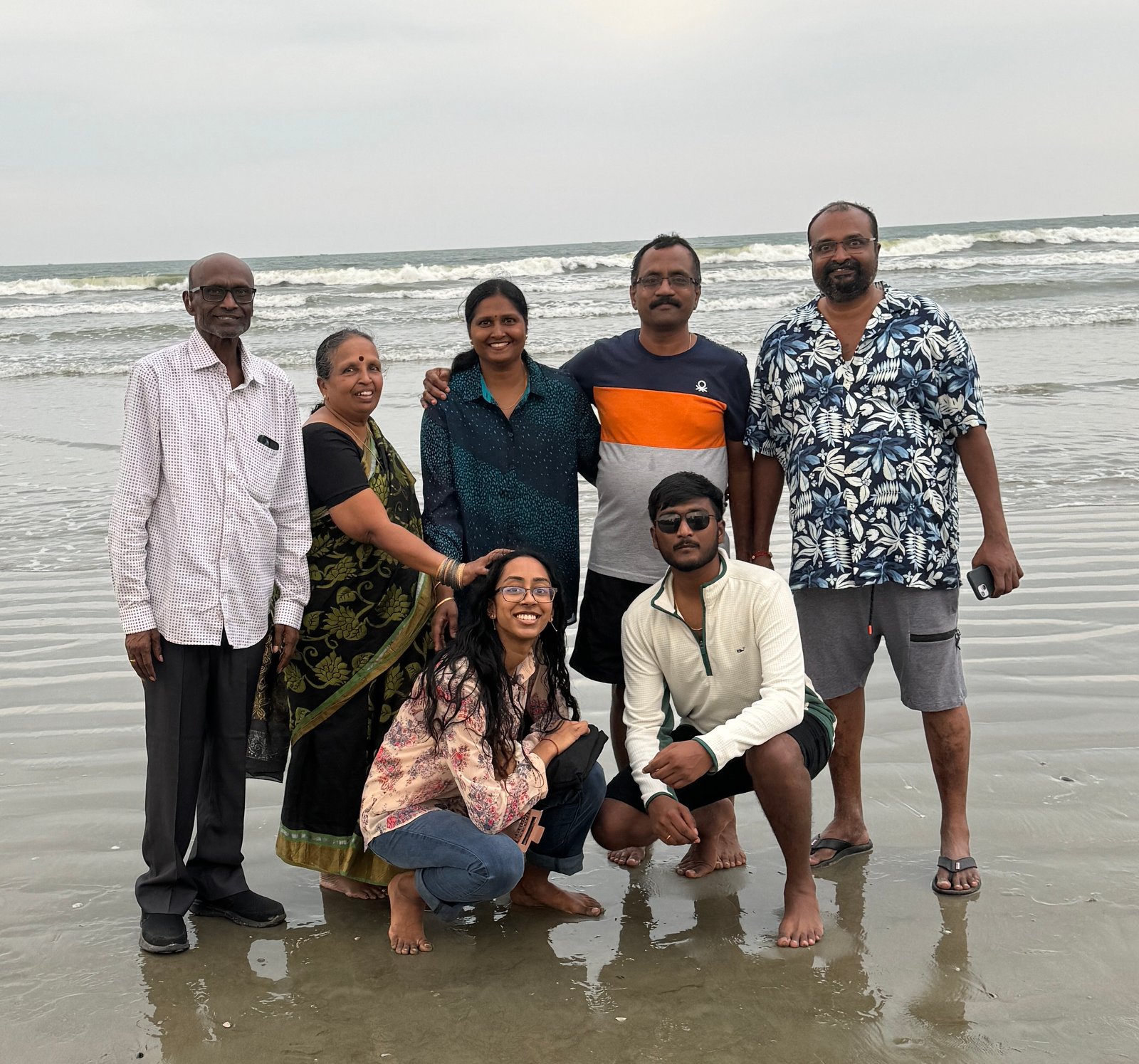 Akash with his family at the beach